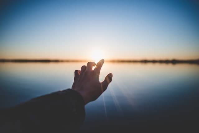 Hand above the water